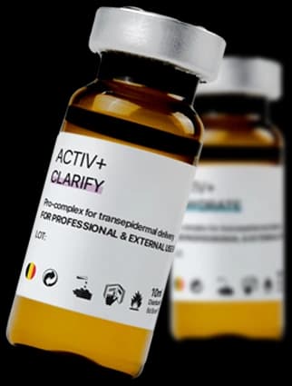 Activ+ — two amber Clarify and Rehydrate ampoules, sealed with brushed metal caps.